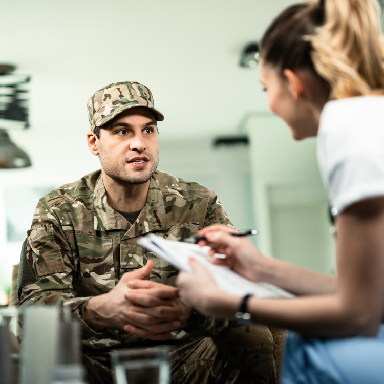 Veteran talking to healthcare worker.